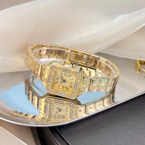 Luxus elegante goldene quadratische Strass-Quarzuhr für Damen mit Edelstahlarmband.