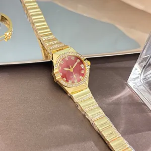 Elegant gold women quartz watch with red dial and rhinestone bezel fashion timepiece detail view