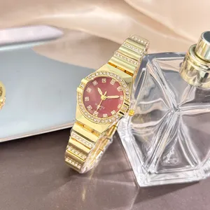 Detailed close-up of a luxury gold rhinestone quartz watch showcasing exquisite dial details.