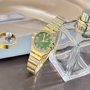 Elegant gold quartz watch with green dial and rhinestones, stylish small bracelet timepiece.
