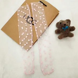 Sheer pink polka dot mesh mid-calf socks for women, lightweight summer sheer tulle hosiery.