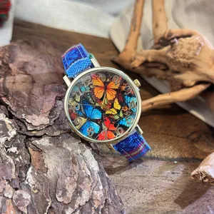 Vintage bohemian style women quartz watch with colorful butterfly dial and woven fabric strap.