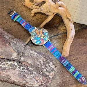 Detailed view of the bohemian canvas strap quartz watch featuring a colorful butterfly dial design.