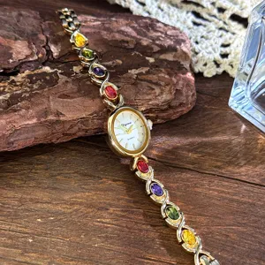 Vintage rainbow gemstone quartz watch with elegant oval dial and sparkling colorful crystal bracelet.