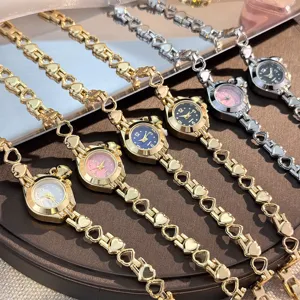 Women's quartz watch with hollow heart bracelet strap, elegant and exquisite jewelry timepiece.