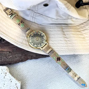 Bohemian quartz watch featuring colorful ethnic canvas strap and intricate mandala dial design.