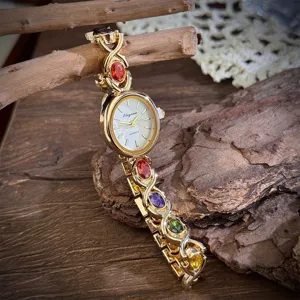 Vintage gold-tone quartz watch for women featuring colorful oval gemstone bracelet details.