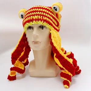 Close-up detail of the funny crochet octopus hat with long tentacles and cute cartoon eyes.