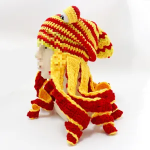 Detailed view of handmade crochet octopus hat, red and yellow funny squid cap costume prop.