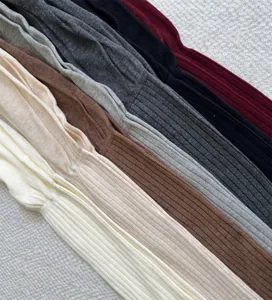 Detailed view of women's ribbed over-the-knee long socks in multiple solid autumn colors.