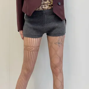 Collants résille ajourés femme sexy avec motif cœur mignon et respirants et fins.