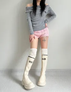 Cozy solid color over the knee long socks for women, winter stacked design detail.