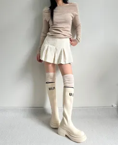 Knee high slouch socks detail showcasing soft ribbed fabric and comfortable fit for daily wear.