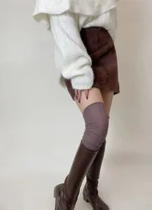 Detailed view of women's ribbed over-the-knee slouchy high socks, soft autumn winter fabric.