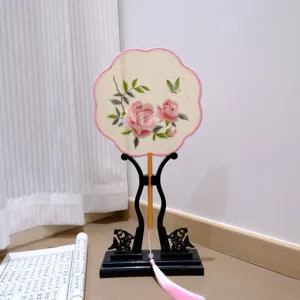 Traditional Chinese embroidered hand fan with stand, elegant pink rose design for Hanfu decor.