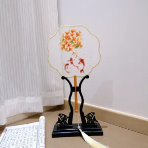 Traditional Chinese embroidered round fan with tassel and stand, perfect Hanfu photo prop decor.