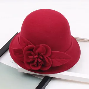 Detailed close-up of a women wool felt cloche hat featuring 3D floral decoration in red color.