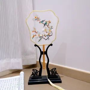 Handheld Chinese style embroidered round fan with wooden stand, traditional decor and photo prop.