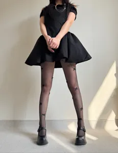 Black fishnet tights for women featuring cute 3d bows, ideal for spring and summer fashion.