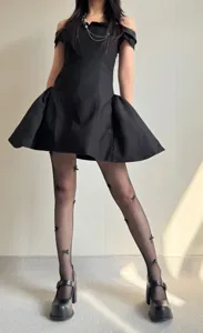 Ballet style black fishnet tights with 3D bows, elegant accessory for stylish summer outfits.