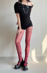 Detailed view of spring and summer red fishnet pantyhose featuring cute handmade 3D bows.