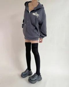 Detailed view of women's ribbed over-the-knee high tube socks, soft cotton winter knit wear.