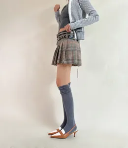 Knee high socks detail shot featuring ribbed texture style, perfect autumn winter fashion outfit.