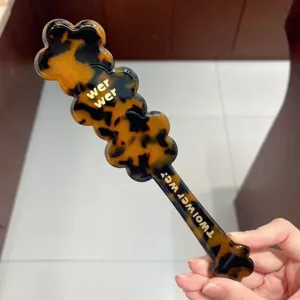 Creamy amber acetate hair brush detail, smooth detangling massage comb daily care.