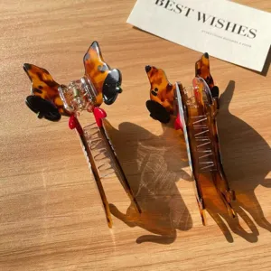 Cute dachshund acetate hair claw detail, tortie pattern design for chic hair styling.