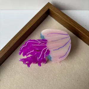 Jellyfish hair claw clip detail view, cute cartoon shark clip for back of head styling.
