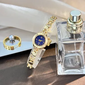 Women quartz watch with hollow heart bracelet strap and blue dial elegant fashion jewelry watch