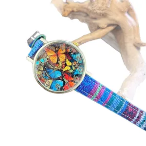 Bohemian style women quartz watch with colorful butterfly dial and ethnic canvas strap.