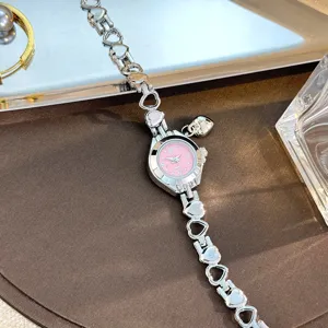 Silver heart-shaped link quartz watch with pink dial delicate bracelet jewelry piece