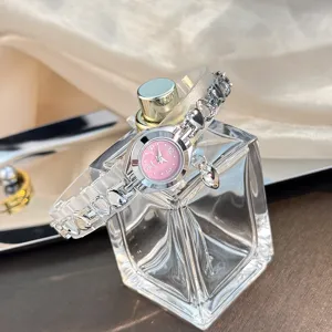 Exquisite heart charm quartz watch detail shot, delicate pink dial, elegant chain.