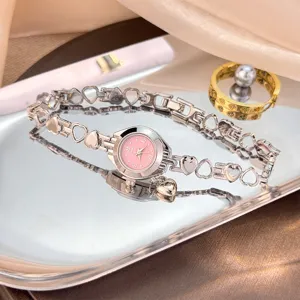 Elegant heart link quartz watch with pink dial and charm for women jewelry gift.