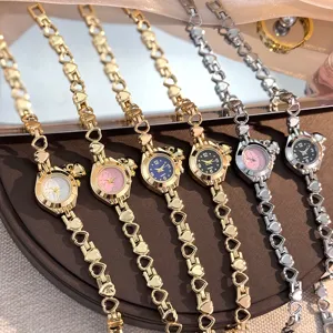 Elegant hollow heart bracelet quartz watch with multiple dial colors for women and girls.