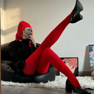 Vibrant red velvet tights for women, stretchy candy color pantyhose for stylish daily wear.