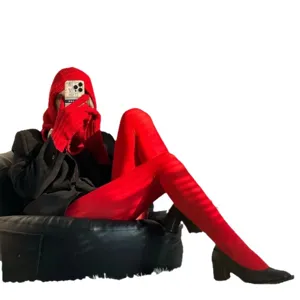 Vibrant red velvet tights for women, matte finish candy color stretch hosiery for autumn.