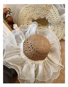 Summer straw sun hat with white organza lace ruffle and elegant pearl trim for beach vacation.