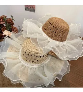 Summer large brim straw hat with elegant white lace mesh ruffles and pearl trim beach cap
