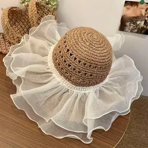 Summer straw sun hat with large lace ruffle brim and pearl detail for women beach vacation.