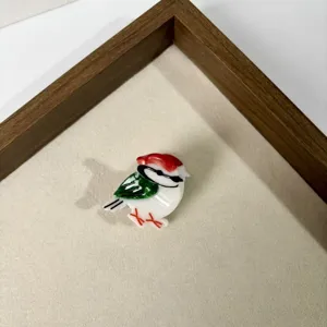 Cute bird hair claw clip detail shot, acrylic mini hair accessory for girls and kids.