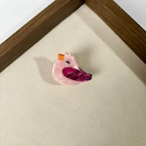 Cute bird acrylic hair claw for kids, sweet animal hair clip detail showing delicate design.