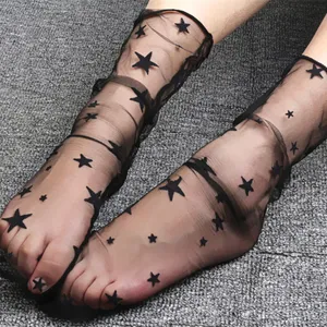 Sheer black mesh star socks for women, trendy transparent summer mid-tube slouch hosiery.