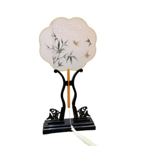 Traditional Chinese embroidered round fan with stand and tassel for Hanfu and cultural events.
