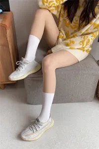 Detail of white fake calf socks and tights, showing soft texture and cozy daily wear style.