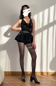 Sexy spitzenbesetzte hohle Netzstrumpfhose für Damen, modische gemusterte Strumpfware.