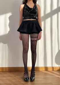 Schwarze spitzenbesetzte hohle Netzstrumpfhose, sexy gothic Stil Strumpfhose für Damen.