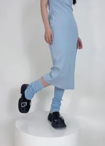 Light blue ribbed knit leg warmers detail shot showing cozy winter style and comfortable fit.