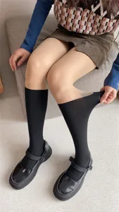 Detailed shot of fake thigh high pantyhose showing stretchable fabric and seamless design.